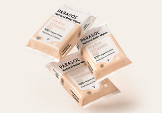 Three packs of Parasol Natural Baby Wipes on a light background