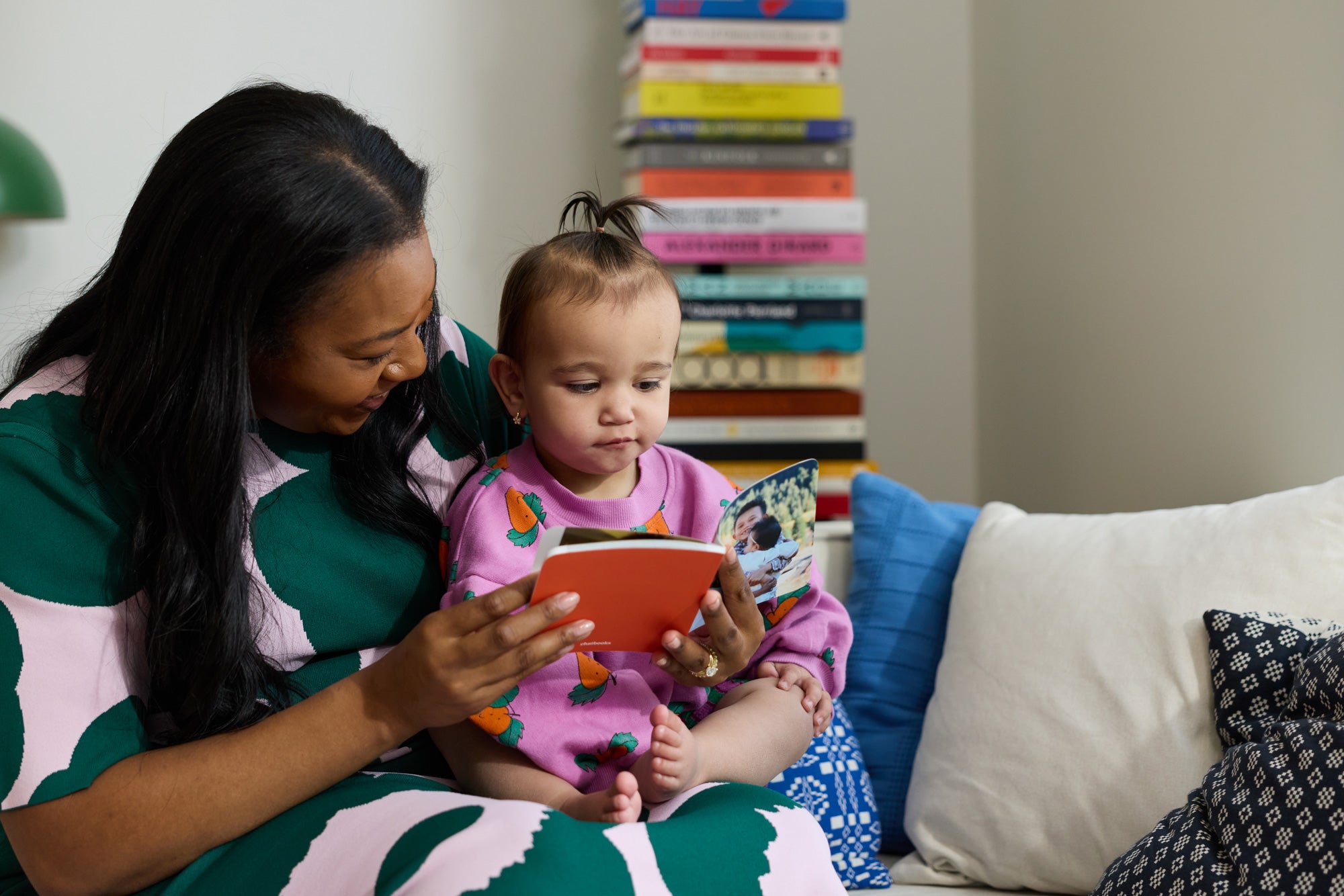 Woman reading to her child.