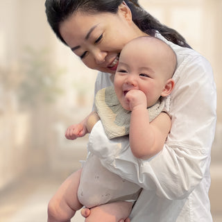 Founder of Parasol, Jessica Hung holding a baby
