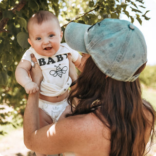 Mother holding baby
